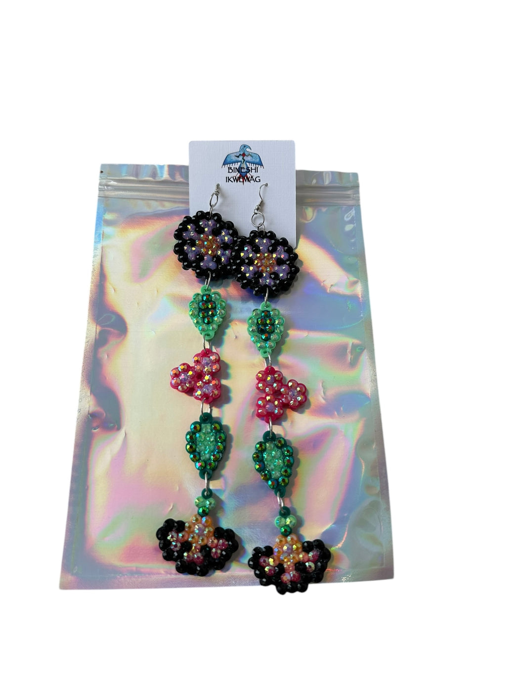 Long purple flower earrings by Bineshi Ikwewag