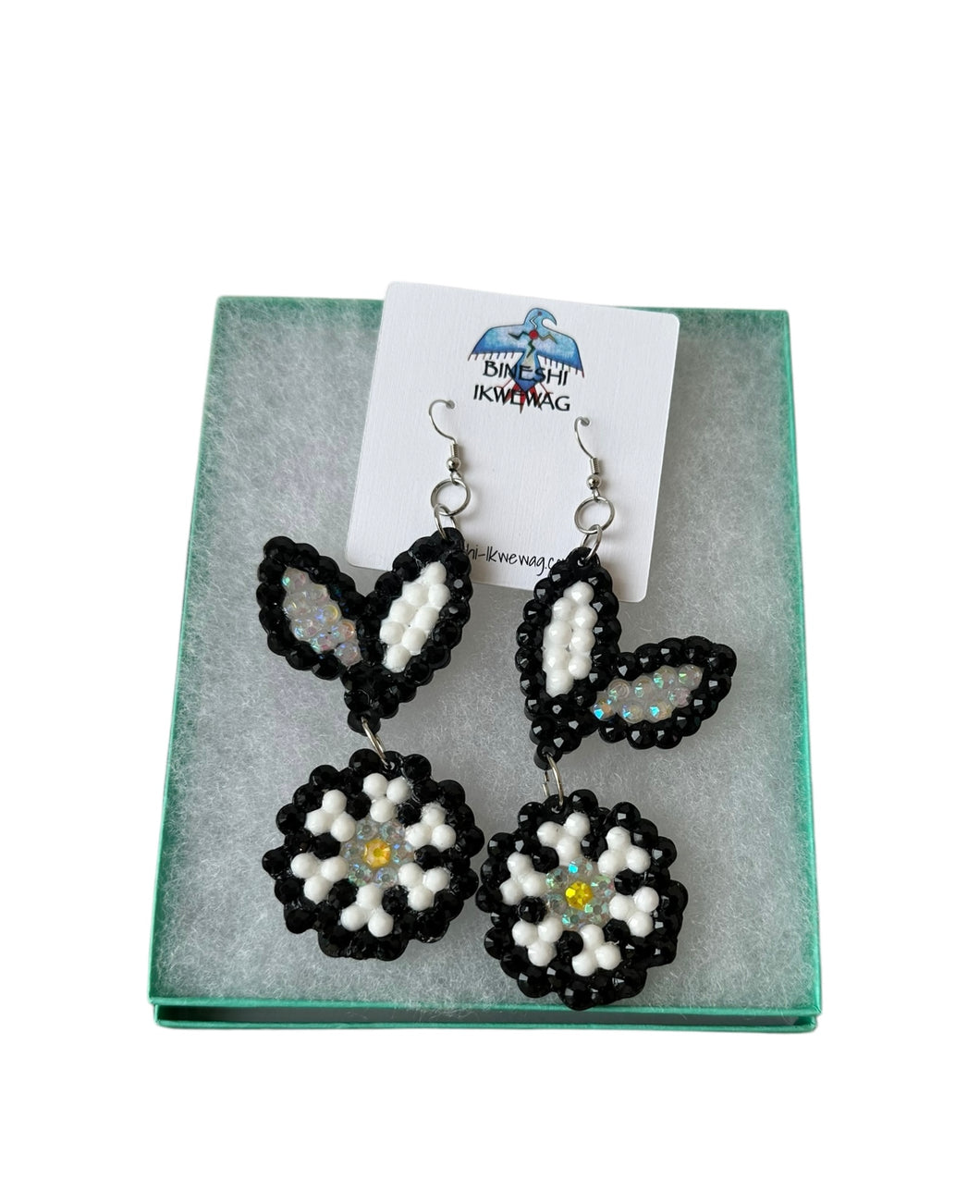 White and black flower earrings by Bineshi Ikwewag